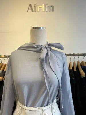 Elegant sheer blouse with a bow tie